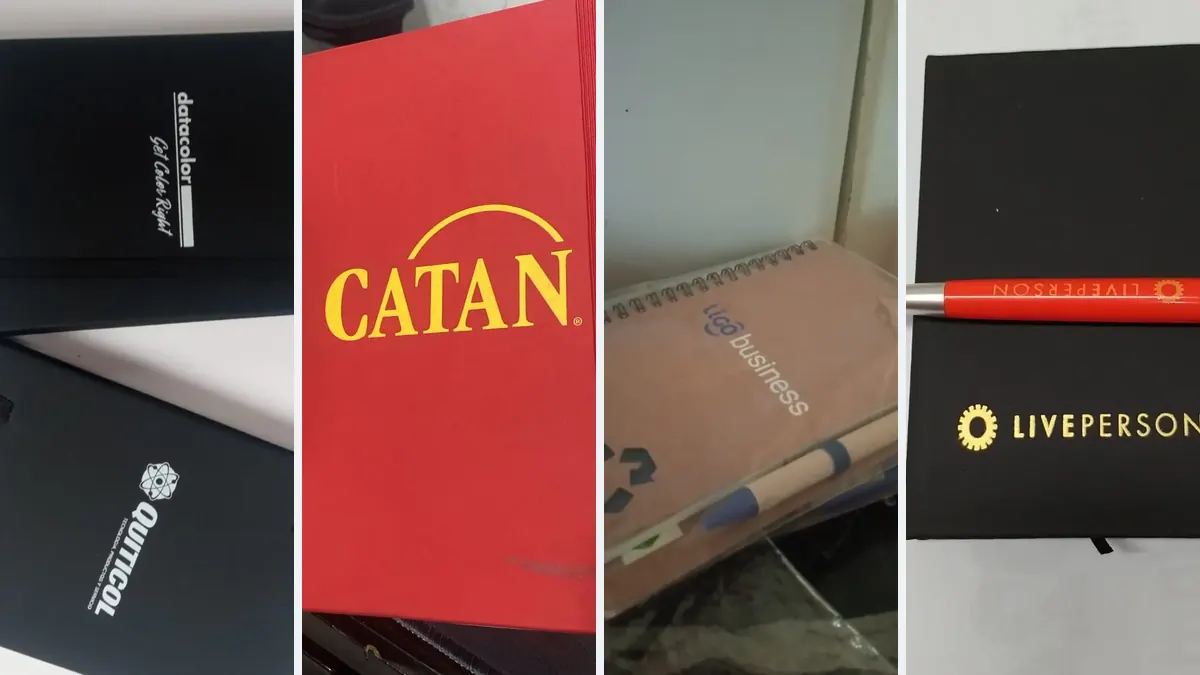 Cuatro libretas promocionales personalizadas con logo: tapa negra, roja, ecológica y negra con logo dorado